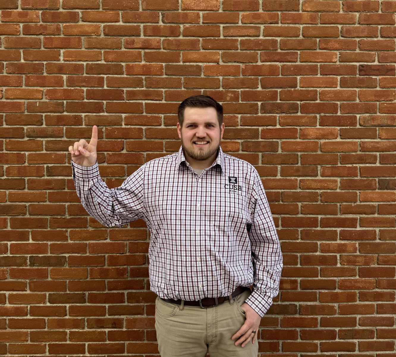 Austin holding up a one with his finger.